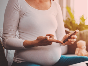 Pregnant woman checking her diabetes level with a glucose pen, highlighting the link between diet and female fertility